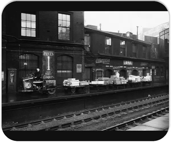 GWR Tractor and trollies on Paddington Station, c1936