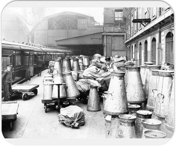 Empty milk churns on Paddington Station, c. 1914