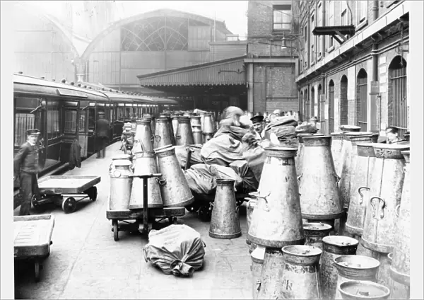 Empty milk churns on Paddington Station, c. 1914