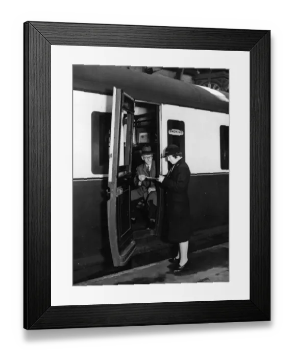 Framed Print : Female Ticket Collector at Paddington Station during WW2 Framed Print : Female Ticket Collector at Paddington Station during WW2