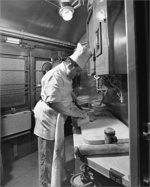 Chef preparing food in the Restaurant Car kitchen, 1946