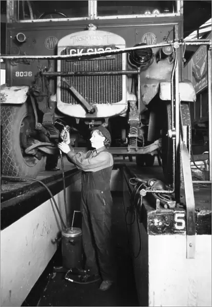 Female worker servicing a Thorncroft lorry at Slough Road Motor Department, 1944