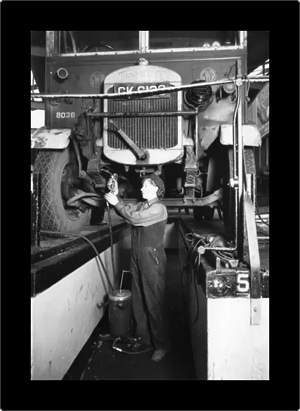 Female worker servicing a Thorncroft lorry at Slough Road Motor Department, 1944