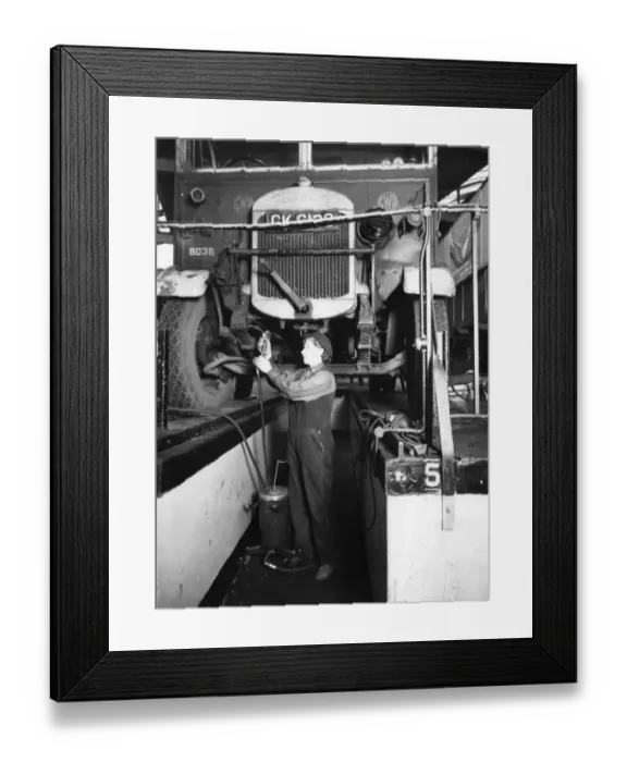 Framed Print : Female worker servicing a Thorncroft lorry at Slough Road Motor Department, 1944 Framed Print : Female worker servicing a Thorncroft lorry at Slough Road Motor Department, 1944