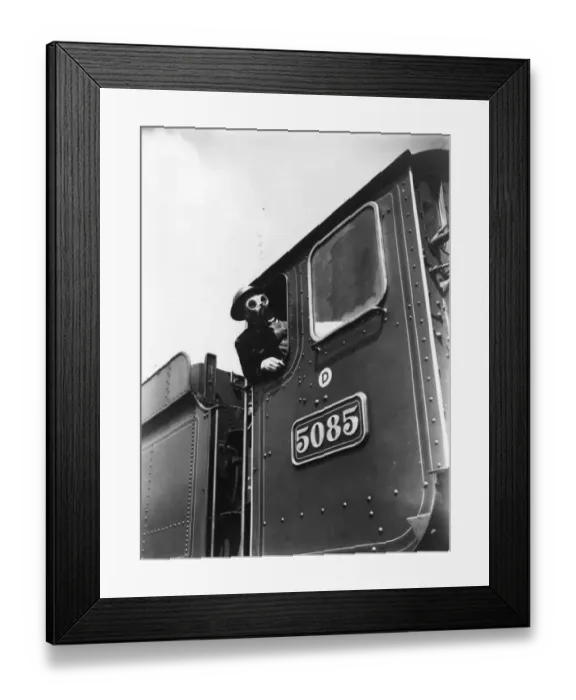 Framed Print : Locomotive driver in air raid kit, during WWII