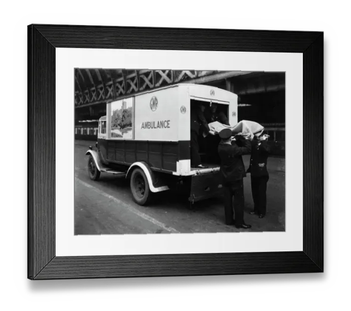 Framed Print : GWR staff loading a stretcher into a parcel van which has been converted into an ambulance, 1940 Framed Print : GWR staff loading a stretcher into a parcel van which has been converted into an ambulance, 1940