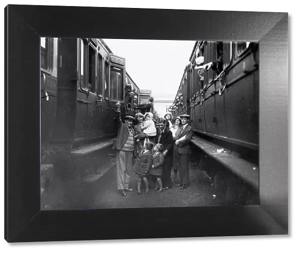 Family boarding a train in the carriage sidings at Swindon, for the annual Works trip, 1932