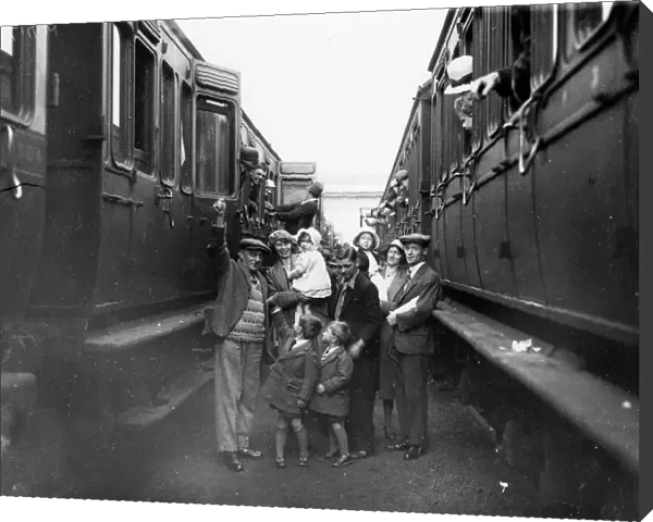 Family boarding a train in the carriage sidings at Swindon, for the annual Works trip, 1932