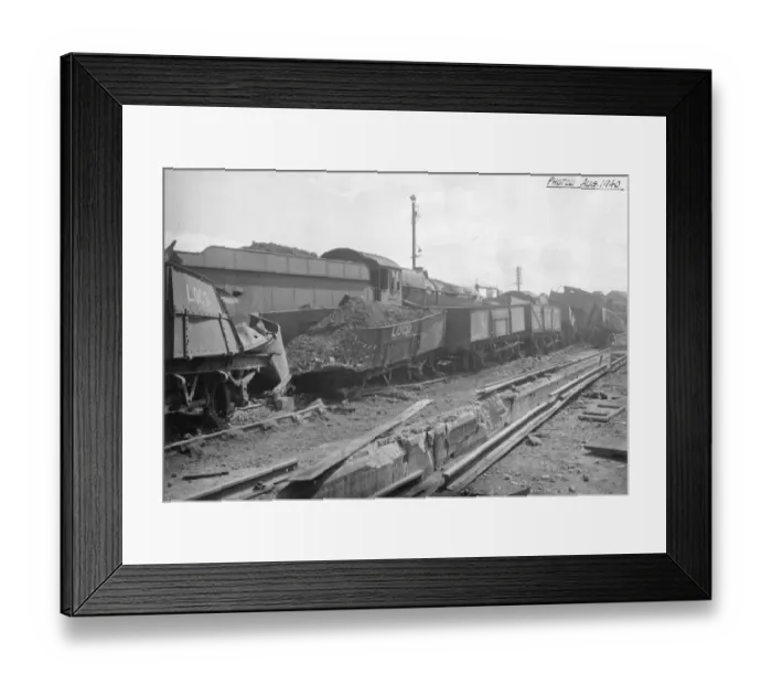 Framed Print : Air raid damage to goods wagons at Newton Abbot Station in 1940 Framed Print : Air raid damage to goods wagons at Newton Abbot Station in 1940