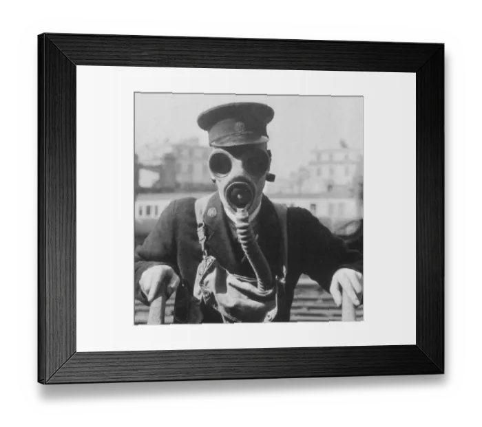 Framed Print : GWR station staff member in a gas mask, c. 1939