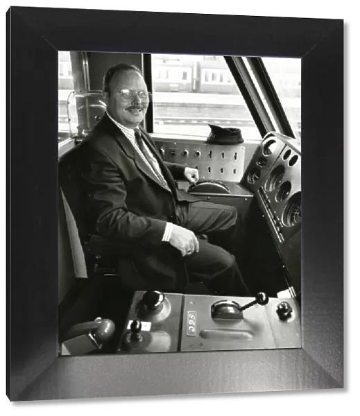 A driver at the controls of a diesel locomotive in about 1980