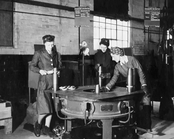 Women war workers making ammunition shells in 24F Shop, 1943