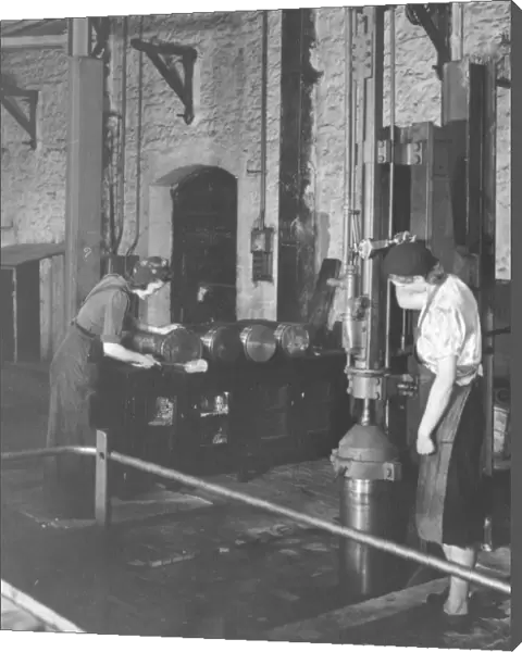 Women war workers stamping ammunition shells in B Shop, 1942