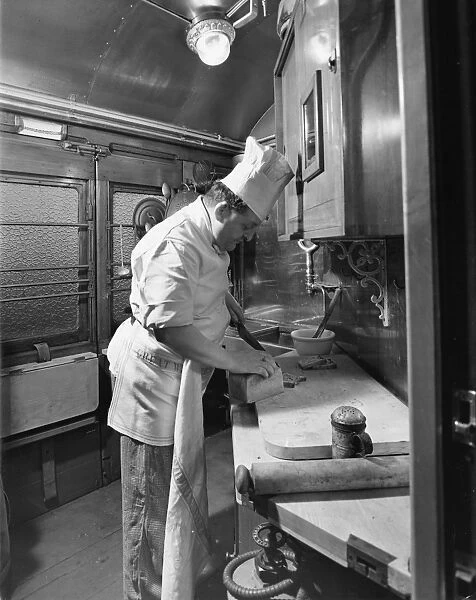Chef preparing food in the Restaurant Car kitchen, 1946