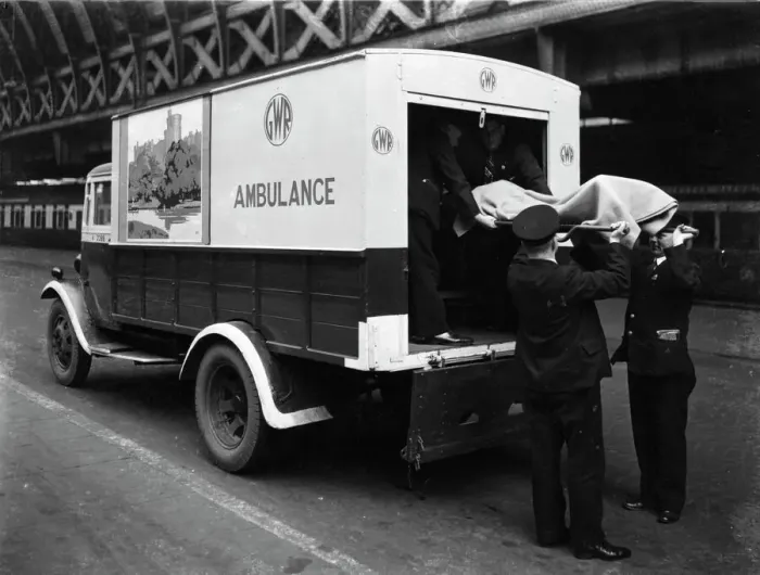 Framed Print : GWR staff loading a stretcher into a parcel van which has been converted into an ambulance, 1940 Framed Print : GWR staff loading a stretcher into a parcel van which has been converted into an ambulance, 1940