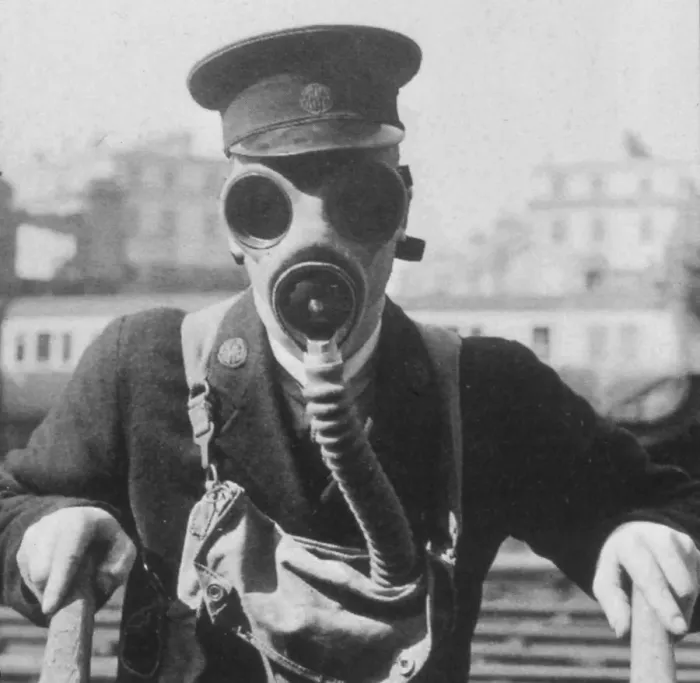 Framed Print : GWR station staff member in a gas mask, c. 1939