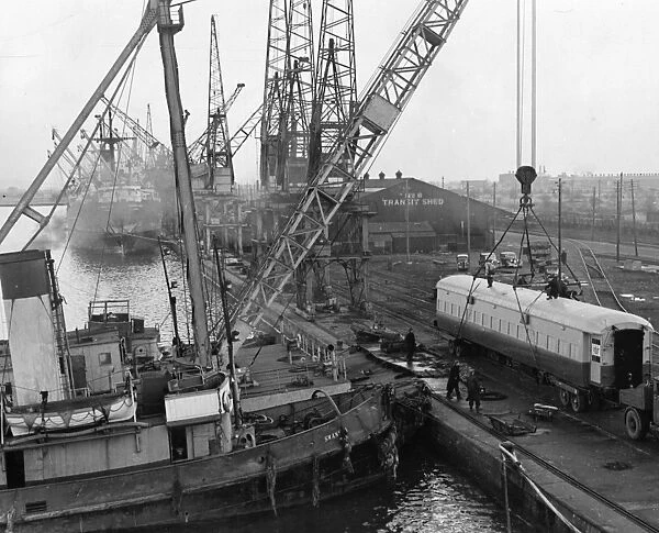 Newport Docks, 1948. 50 ton floating crane lifting railway coach off road
