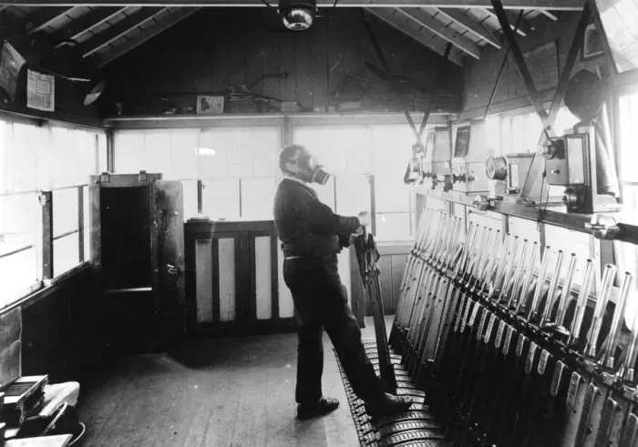 Framed Print : Signalman in operating signal levers during wartime, c. 1940 Framed Print : Signalman in operating signal levers during wartime, c. 1940