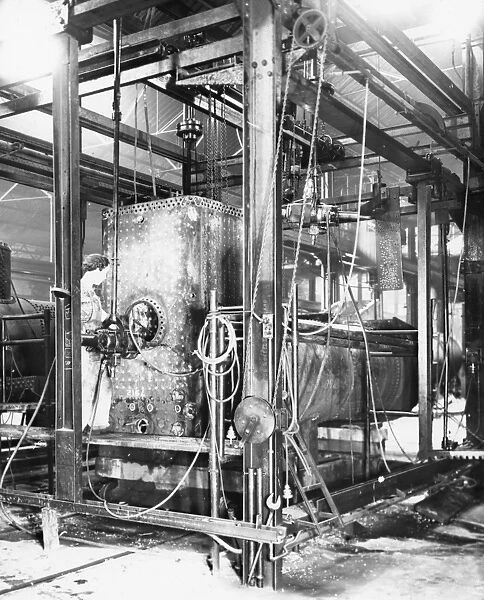 V Shop, 1943. Female worker drilling crown plate of boiler firebox