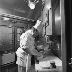 Chef preparing food in the Restaurant Car kitchen, 1946