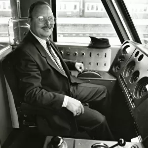 A driver at the controls of a diesel locomotive in about 1980