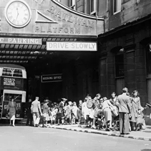 Evacuees waiting outside the departure platform at Paddington in 1939