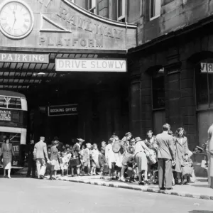 Evacuees waiting outside the departure platform at Paddington in 1939