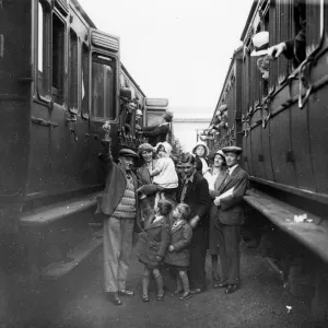 Family boarding a train in the carriage sidings at Swindon, for the annual Works trip, 1932