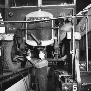 Female worker servicing a Thorncroft lorry at Slough Road Motor Department, 1944