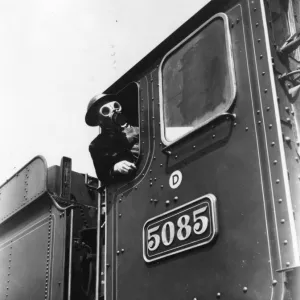 Locomotive driver in air raid kit, during WWII