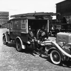 A petrol trailer fire pump hauled by an ex-GWR Express Cartage van, 1940