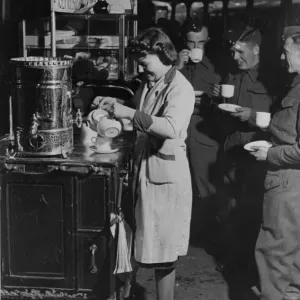 Servicemen drinking tea from a refreshment trolley on Paddington station, during WWII Servicemen drinking tea from a refreshment trolley on Paddington station, during WWII