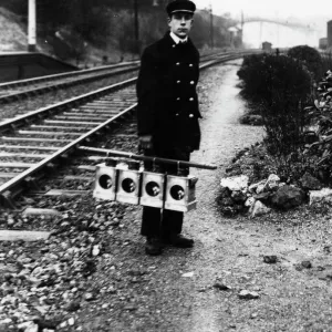 Signal lamp man servicing signal lanterns, c1930s