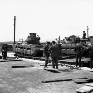 Tanks being loaded onto Rectank flat wagons, c. 1940