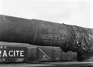 The Railway at War Collection: A 16 inch gun barrel loaded onto an eighteen wheel gun wagon in 1942