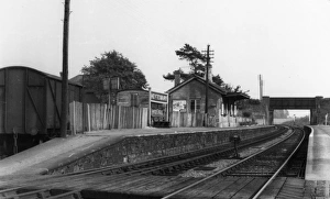 Prints of A view of Heytesbury station near Warminster in Wiltshire, showing the platforms, station buildings, road bridge and goods wagons. Heytesbury station opened in 1856 and closed in 1955 Wiltshire Stations Prints: Heytesbury Station, Wiltshire