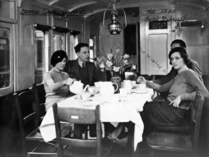 Camping Gallery: Interior view of Camp Coach showing a close up view of dining room, 1935