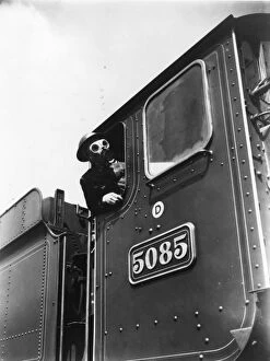 Locomotive driver in air raid kit, during WWII