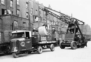 Crane Collection: Scammel being loaded with Anderson Air Raid Shelter, West London, 1939