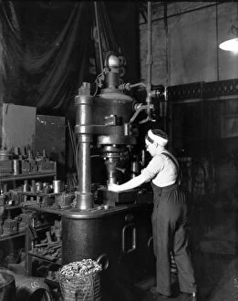 Woman using steam press at Swindon Works, 1942